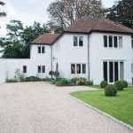 House exterior with surrounding yard and driveway