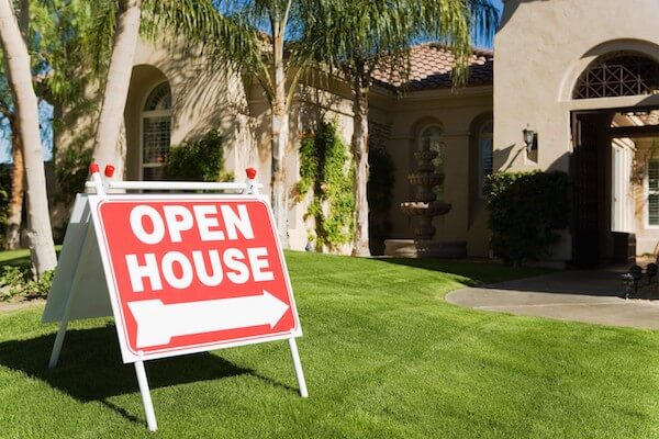 open house sign in front of a home