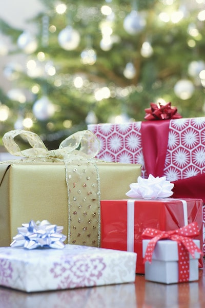 Gifts with Christmas tree in background